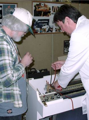 Martin showing John McIntyre the art of lacing tapes